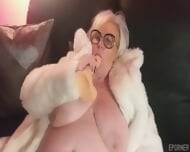 Blonde Granny In White Fur Coat